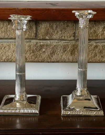 Silver corinthian candlesticks after
